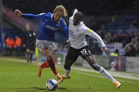 Idris Kanu of Peterborough United battles with Marcus Harness of Portsmouth. Photo: Joe Dent/theposh.com.