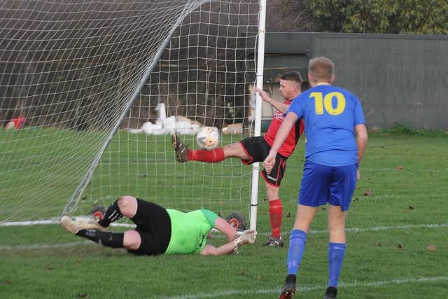 Action from Stilton United (red) v Peterborough North End Sports. Photo: David Lowndes.