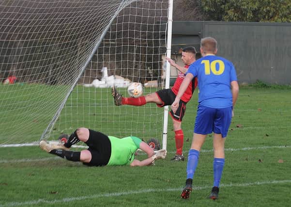 Action from Stilton United (red) v Peterborough North End Sports. Photo: David Lowndes.