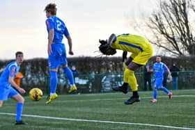 Maniche Sani (yellow) scores for Peterborough Sports against Yaxley. Photo: James Richardson.