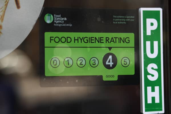 A Food Standards Agency rating sticker on a window of a restaurant. Photo: PA EMN-200912-130213001
