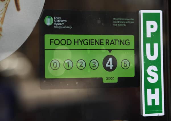 A Food Standards Agency rating sticker on a window of a restaurant. Photo: PA EMN-200912-130213001