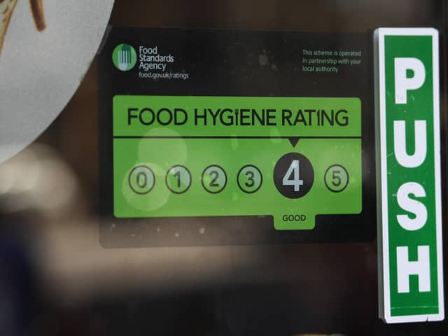 A Food Standards Agency rating sticker on a window of a restaurant. Photo: PA EMN-200912-130213001