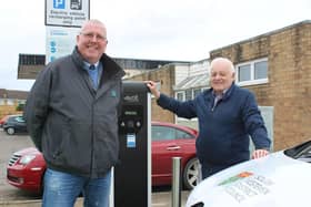 SKDC Cabinet Member for Commercial and Operations Coun Dr Peter Moseley and Deputy Leader Coun Barry Dobson at the charging points in Market Deeping. EMN-200912-131648001