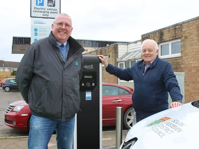 SKDC Cabinet Member for Commercial and Operations Coun Dr Peter Moseley and Deputy Leader Coun Barry Dobson at the charging points in Market Deeping. EMN-200912-131648001