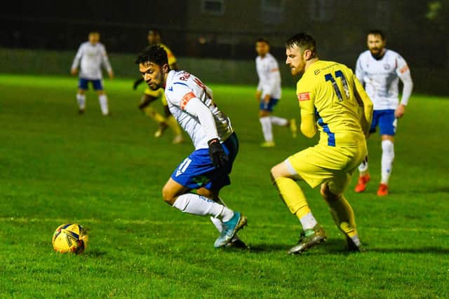 Josh Moreman tracks AFC Rushden & Diamonds' Luke Fairlamb during Peterborough Sports' big 5-1 success in the FA Trophy on Tuesday night. Picture courtesy of Hawkins Images Photography