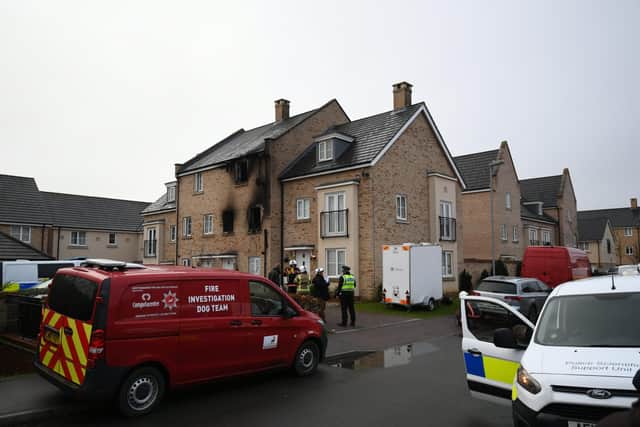 Emergency services at the scene of a house fire on Buttercup Avenue, Eynesbury, Cambridgeshire, in which a three-year-old boy and a seven-year-old girl died. Picture: Press Association.