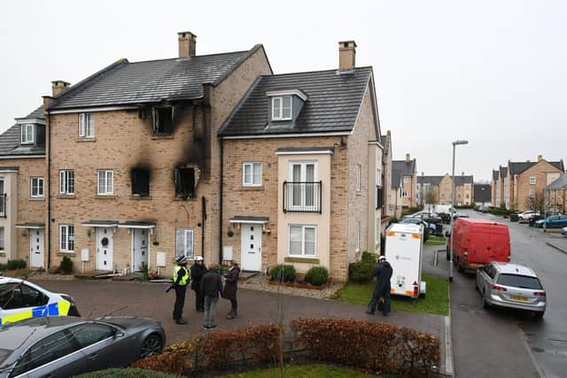Emergency services at the scene of a house fire on Buttercup Avenue, Eynesbury, Cambridgeshire, in which a three-year-old boy and a seven-year-old girl died. Picture: Press Association.