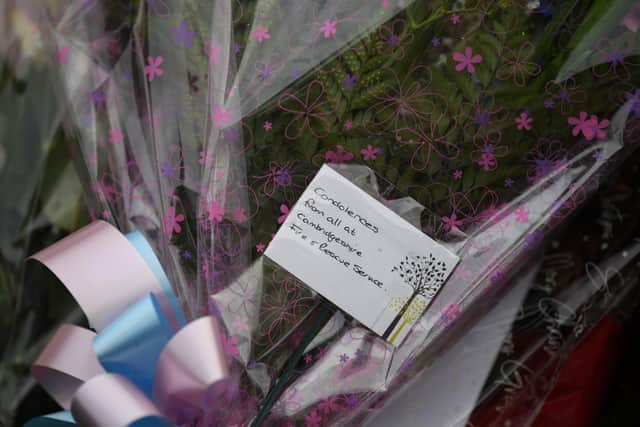 Floral tributes from the Cambridgeshire Fire and Rescue Service at the scene of a house fire on Buttercup Avenue, Eynesbury, Cambridgeshire, in which a three-year-old boy and a seven-year-old girl died. A 35-year-old woman and a 46-year-old were also injured in the fire at the three-storey house, which police believe broke out around 7am Thursday morning. EMN-201112-163046001