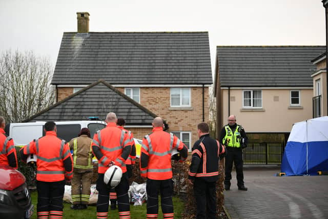 Members of the Cambridgeshire Fire and Rescue Service lay flowers at the scene of a house fire on Buttercup Avenue, Eynesbury, Cambridgeshire, in which a three-year-old boy and a seven-year-old girl died. A 35-year-old woman and a 46-year-old were also injured in the fire at the three-storey house, which police believe broke out around 7am Thursday morning. EMN-201112-163034001