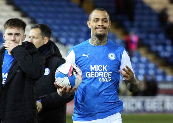 Jonson Clarke-Harris of Peterborough United with the match ball at full-time after scoring a hat-trick against Rochdale. Photo: Joe Dent/theposh.com.