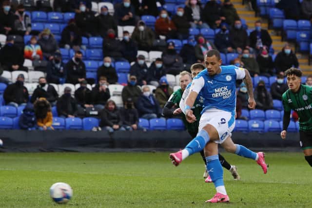 Jonson Clarke-Harris of Peterborough United scores the opening goal from the penalty spot against Rochdale. Photo: Joe Dent/theposh.com.
