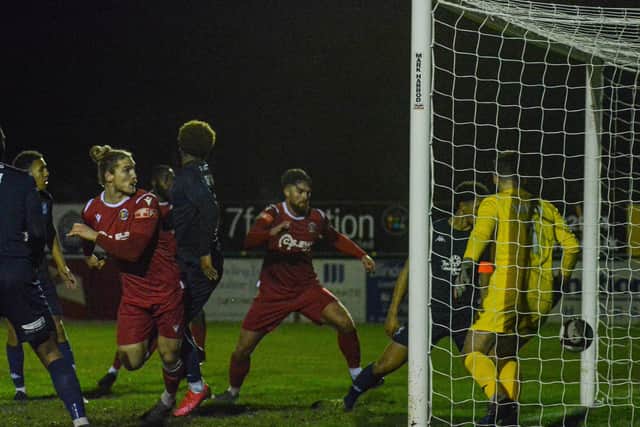 Rob Morgan (foreground, red) scores for Stamford v Kidderminster. Photo: Dan Allen.