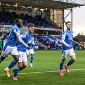 From the left, Idris Kanu, Harrison Burrows and Flynn Clarke celebrate Posh's second goal against Rochdale last weekend. Photo: Joe Dent/theposh.com.