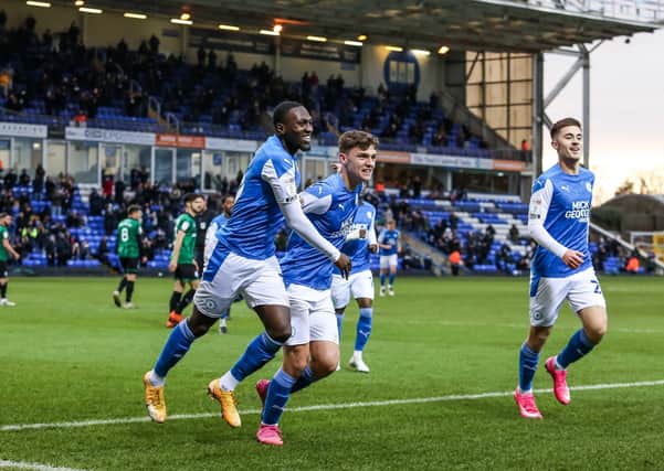 From the left, Idris Kanu, Harrison Burrows and Flynn Clarke celebrate Posh's second goal against Rochdale last weekend. Photo: Joe Dent/theposh.com.