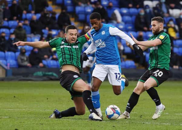 Reece Brown (centre) in action for Posh against Rochdale at the Weston Homes Stadium last weekend. Photo: Joe Dent/theposh.com.