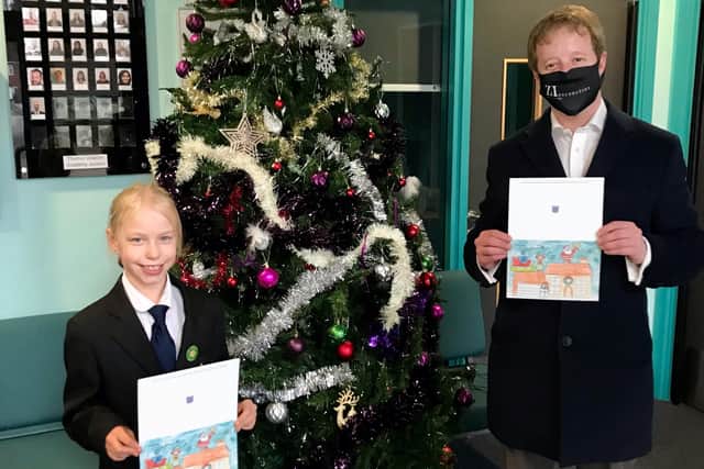 PaulBristow with Kaitlyn from the Thomas Deacon Academy who designed the MP's Christmas card.