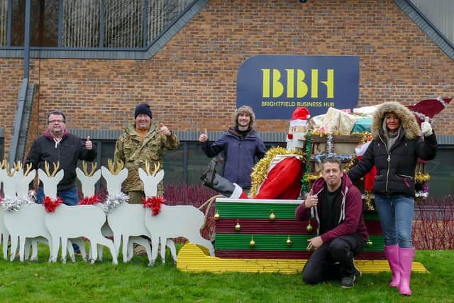 The Up The Garden Bath team that has created the Santa's Sleigh display from recycled materials.