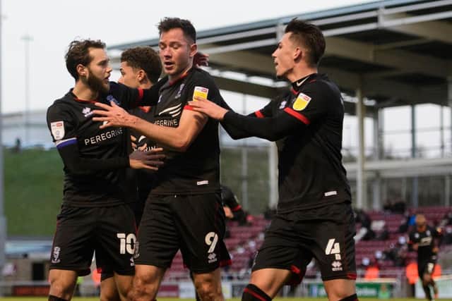Lincoln City were 4-0 winners at Northampton Town to go level on points with league one leaders Portsmouth