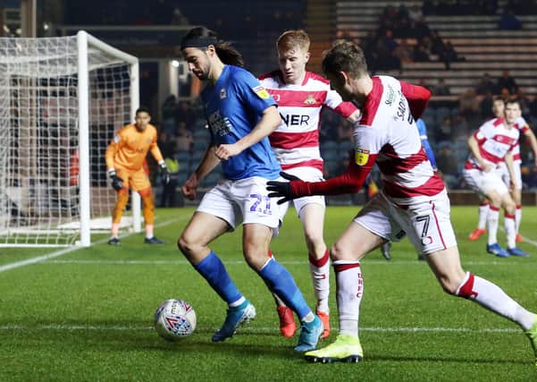 Action from Posh v Doncaster last season.