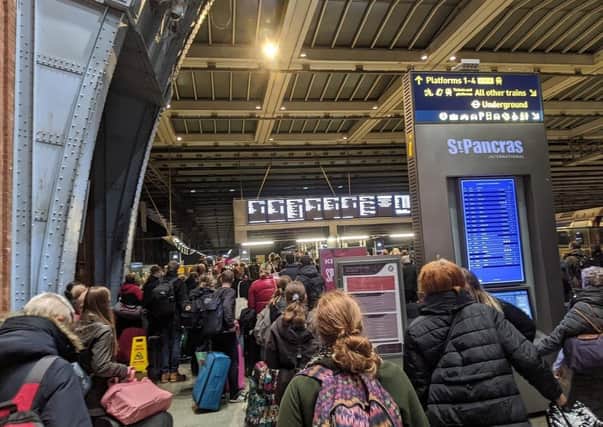 These shocking images show St Pancras train station packed with masked passengers desperate to get home for Christmas before Tier 4 restrictions hit London. Pic: SWNS
