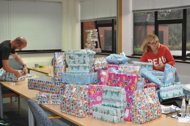 Staff at Vistry East Midlands wrapping the donated gifts for Light Project Peterborough.