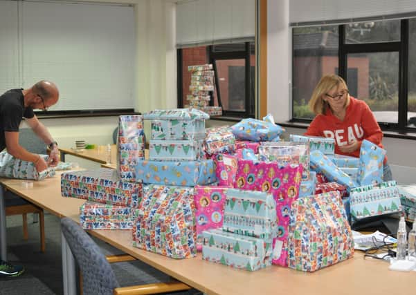Staff at Vistry East Midlands wrapping the donated gifts for Light Project Peterborough.