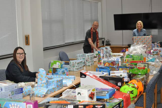 Staff at Vistry East Midlands wrapping the donated gifts for Light Project Peterborough.