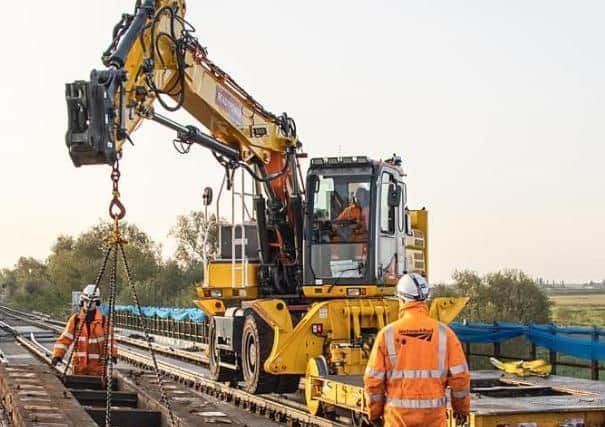 The workers completing the project