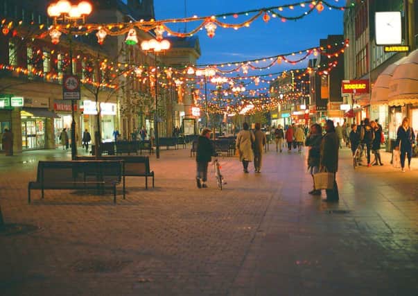 Bridge Street lit up with Christmas displays.