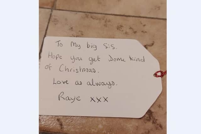 The tag attatched to a now missing present to Raye's sister in London.