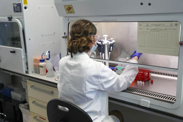 A scientist at work in the manufacturing laboratory where a vaccine against Covid-19 has been produced at the Oxford Vaccine Group's facility at the Churchill Hospital in Oxford. The vaccine, which has been described as a "game changer", has now been approved for use in the UK by the Medicines and Healthcare products Regulatory Agency (MHRA).