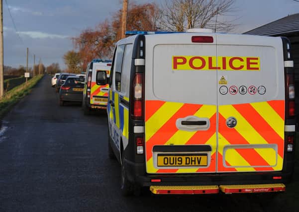 Police vehicles at Speechley Drove, Newborough.