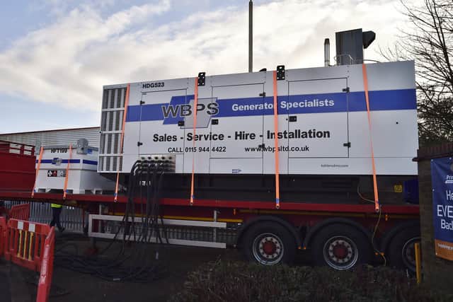Large generator installed outside factory at Wainman Road, Woodston EMN-210401-122159009