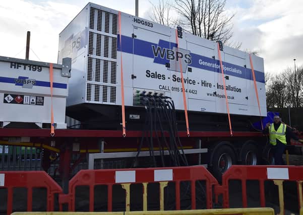 Large generator installed outside factory at Wainman Road, Woodston EMN-210401-122148009