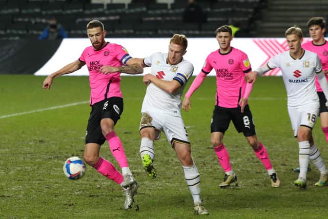 Mark Beevers (front) in action for Posh at MK Dons in December. Photo: Joe Dent/theposh.com.