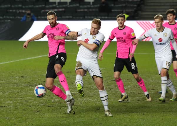 Mark Beevers (front) in action for Posh at MK Dons in December. Photo: Joe Dent/theposh.com.