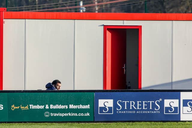 Nathan Thompson watches on after his red card at Lincoln. Photo: Joe Dent/theposh.com.