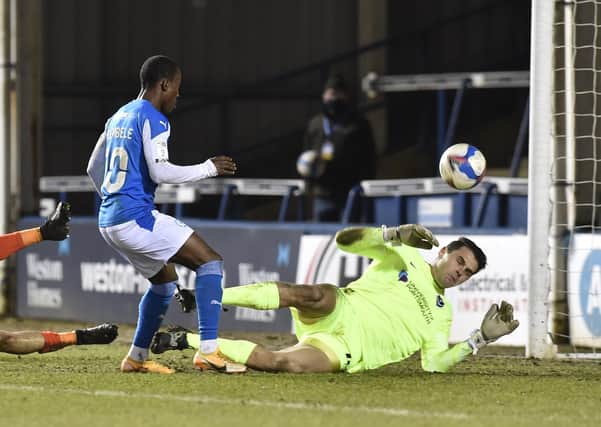 Siriki Dembele scores for Posh against Portsmouth in the Papa John's Trophy. Photo: David Lowndes.