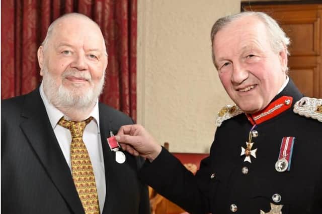 Brian Gascoyne is presented with his BEM by Sir Hugh Duberly, Lord Lieutenant