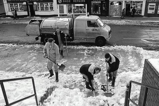 Shovelling snow near Andys Records (see top right).