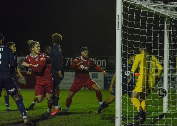 Rob Morgan (red, front) scores for Stamford AFC against Kidderminster. Photo: Dan Allen.
