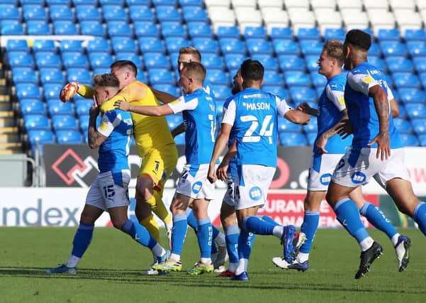 Posh players celebrate the only League One goal scored by Sammie Szmodics this season, on Sptember 19 v Fleetwood.