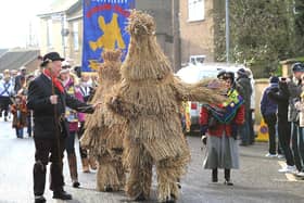 The annual Whittlesea Straw Bear Festival parade through the streets.