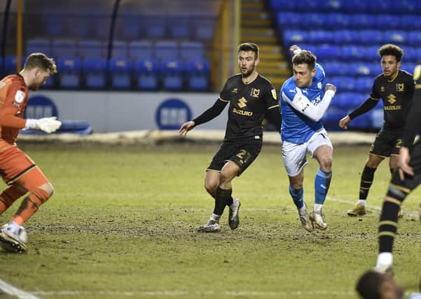 Sammie Szmodics claims his second goal of the game for Posh against MK Dons. Photo: David Lowndes.