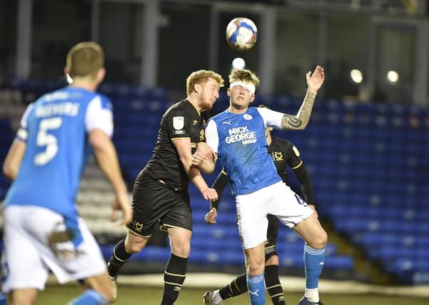 A patched-up Frankie Kent in action for Posh against MK Dons. Photo: David Lowndes.