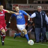Marcus Maddison (right) in action for Posh.