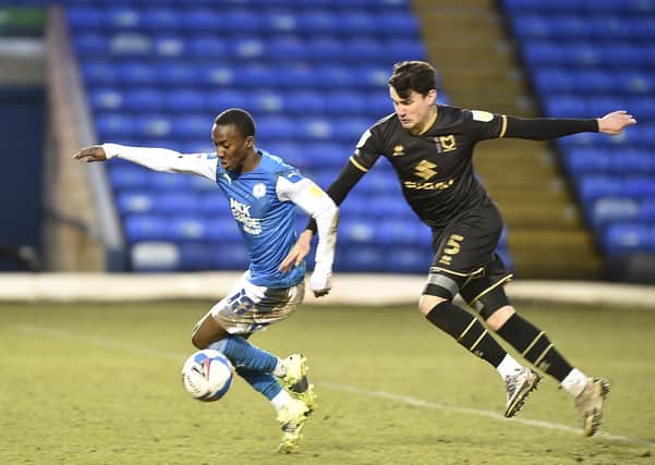 Siriki Dembele in action for Posh against MK Dons. Photo: David Lowndes.