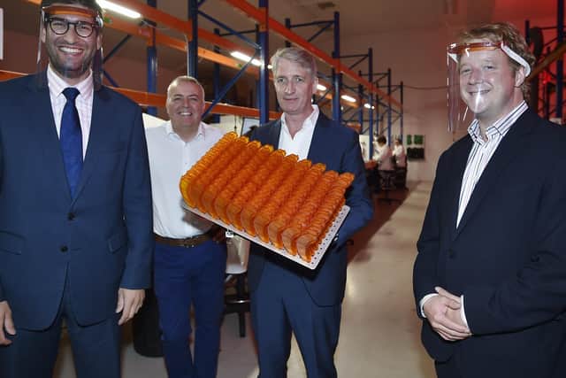 Peterborough MP Paul Bristow, right, and  Ranjl Jayawardena, Minister for International Trade, left, visiting Photocentric with managing director Paul Holt, centre, and Paul McGurk, in charge of manufacturing, last September. 
EMN-200917-145346009