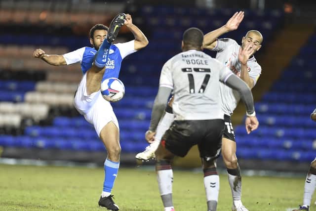 Posh defender Nathan Thompson and Charlton's Darren Pratley (right) battle for the ball. Photo: David Lowndes.